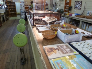 Folding stools and the beautiful broad planks of the haberdashery counter at Corfield & Fitzmaurice Store, Winton.