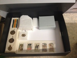 Conserved artefacts stored in archival box.