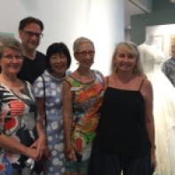 Cairns Museum volunteers used their sewing prowess to dress the mannequins, here with exhibition designer, Michael Marzik. Image: Suzanne Gibson.