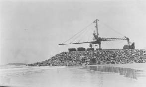 The Telpher crane constructing the southern breakwall. NQBP Collection